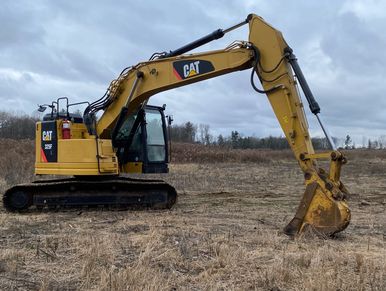 CAT excavator on clearing site