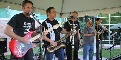 A band plays at the Friends of the Library and Museum's summer concert series at the Littleton Historical Museum. 