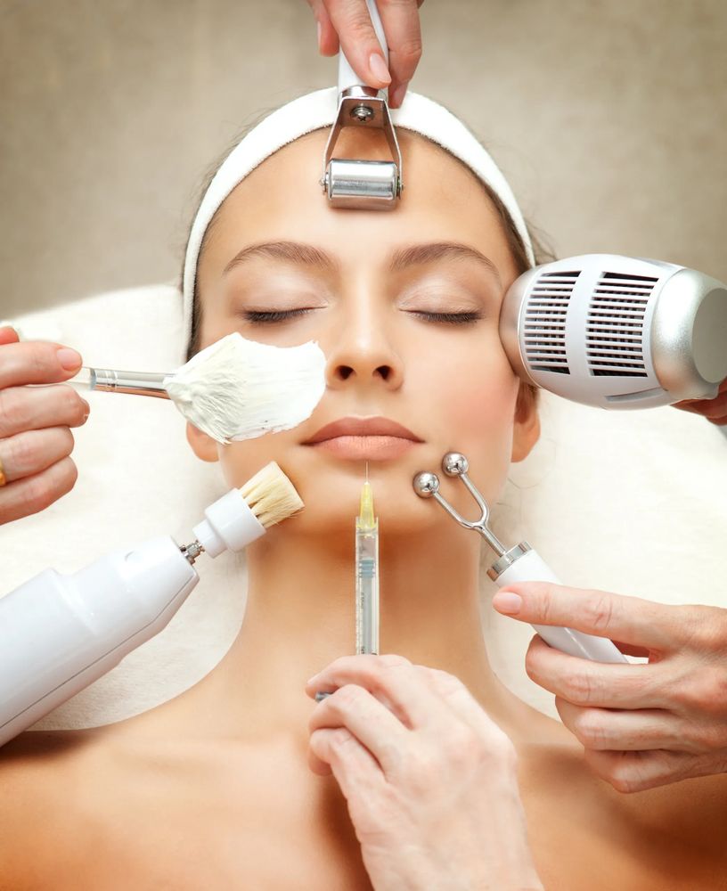 Woman receiving multiple facial treatments simultaneously at a spa.