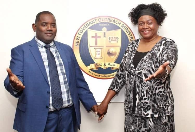 A man and woman holding hands and smiling in front of a ministry logo.