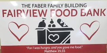 Sign for Fairview Food Bank with heart symbols and a quote about hunger.