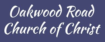 Sign reading Oakwood Road Church of Christ in white script on blue background.