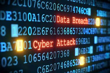 Digital code highlighting 'Data Breach' and 'Cyber Attack' warnings.