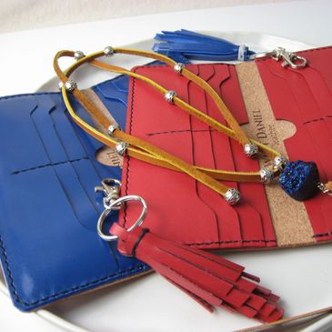 Leather wallet in red or blue.