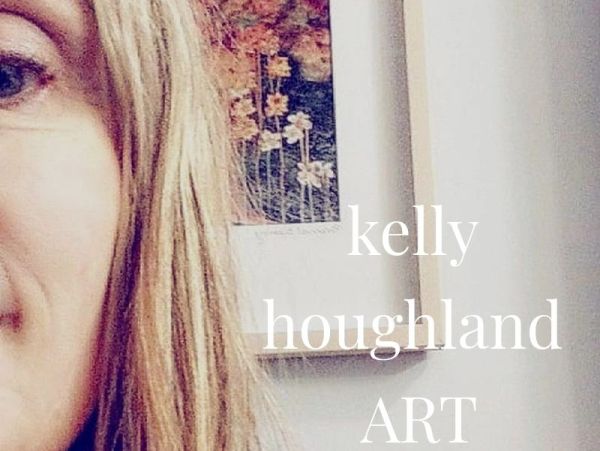 Close-up of a woman's face with art in the background.