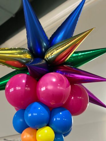 Colorful spiked and round balloons in a decorative arrangement.