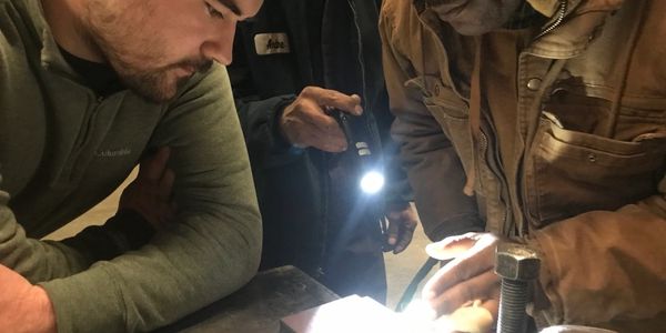 Weld inspector looking at welds