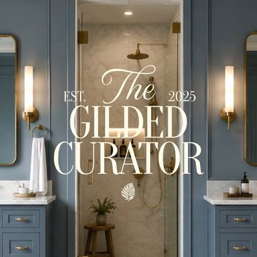 Elegant bathroom with blue cabinetry and a marble shower.