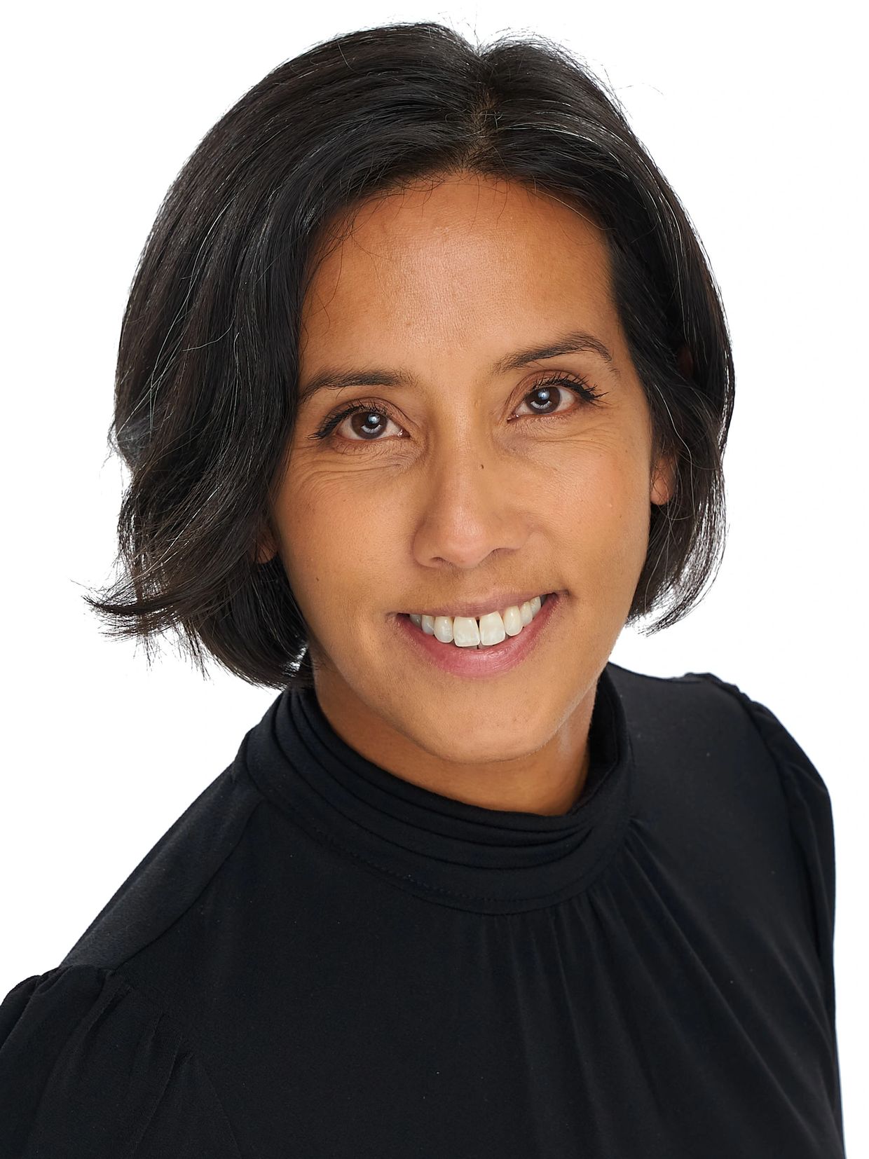 Smiling woman with short black hair wearing a black top.