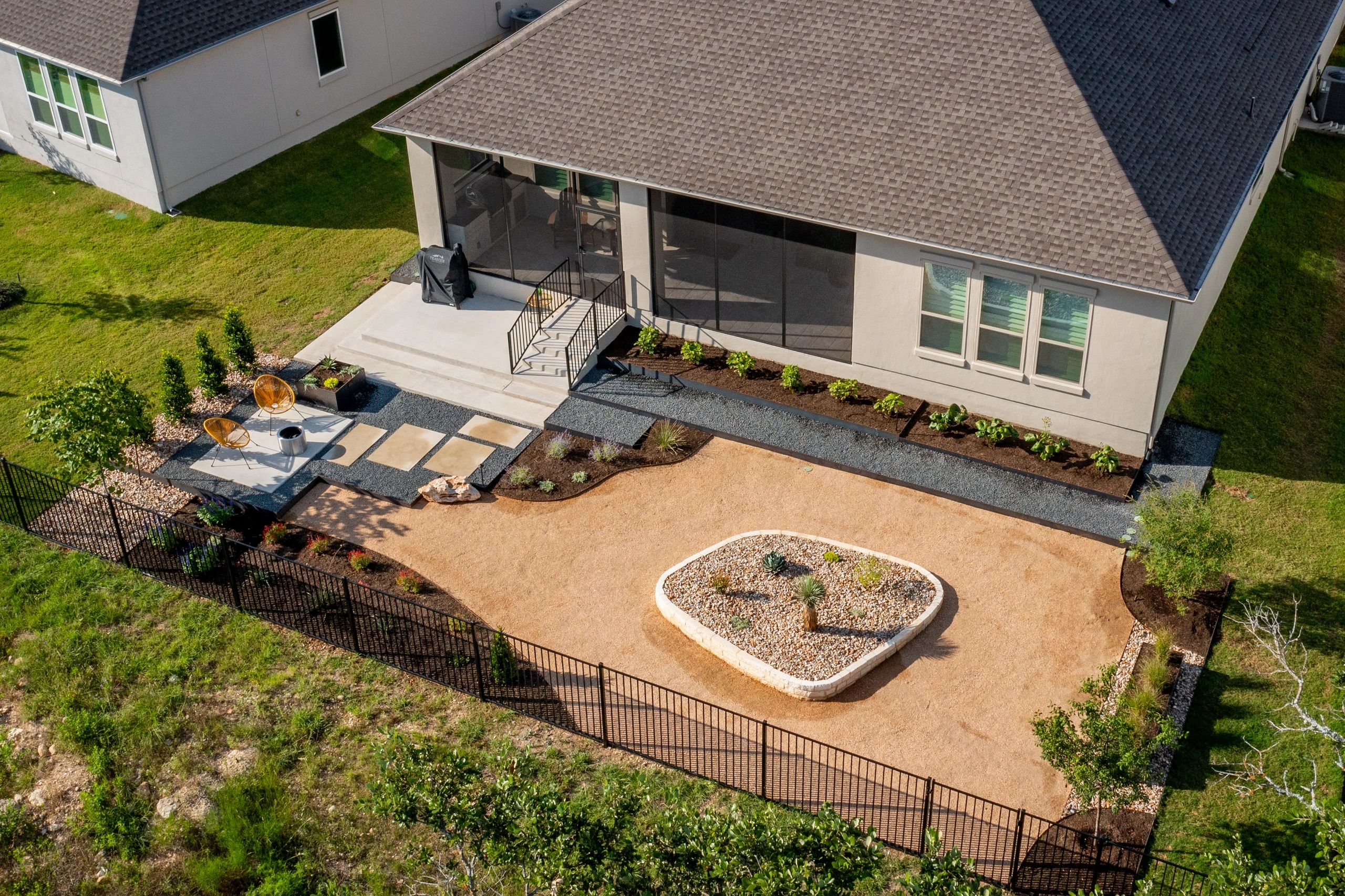 Residential landscape installation managed through a design-build process in Cedar Park Texas