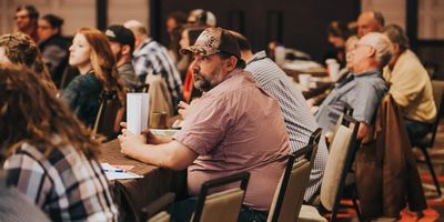 People attentively listening at a conference or seminar.