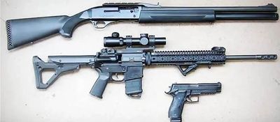 Shotgun, Rifle, Pistol laid out on a white background. To show that we sell all sorts of firearms. 