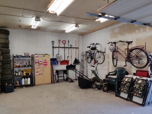 Client BM, Garage pt 1, Decluttered and organized. Tools and bikes hung on the walls. 