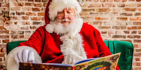 SANTA LOVES READING TO CHILDREN