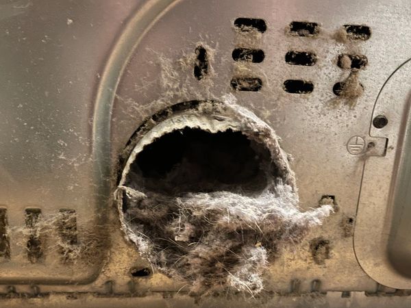 A dryer with accumulated lint.