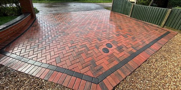 Clean block paving driveway after professional pressure washing for restored colour and finish.