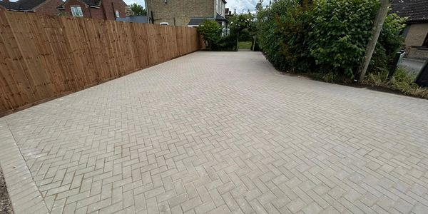 Block paving driveway with herringbone pattern installed by Butler’s Resin and Construction.