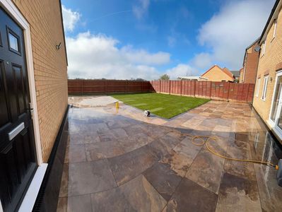 Porcelain patio and lawn garden transformation in Thorney with modern clean finish and drainage