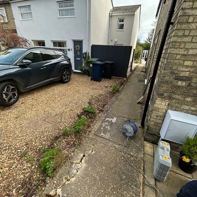 Old cracked slabs and worn frontage before resin bound transformation in Warboys Cambridgeshire