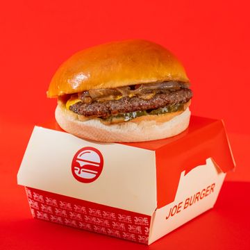 Classic cheeseburger with pickles on a Joe Burger box.