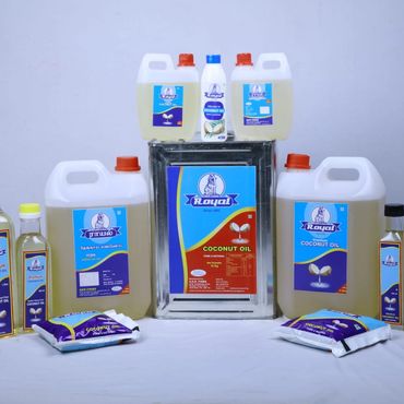 Various containers of Royal coconut oil and other products displayed on a white surface.