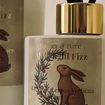 Bottle with a rabbit illustration and gold cap.