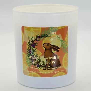 Scented candle with rabbit illustration.