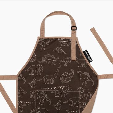 Brown apron with dinosaur patterns.