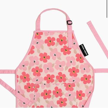 Pink floral apron with adjustable neck strap.