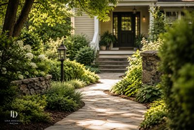 A serene garden pathway leading to a cozy home entrance.