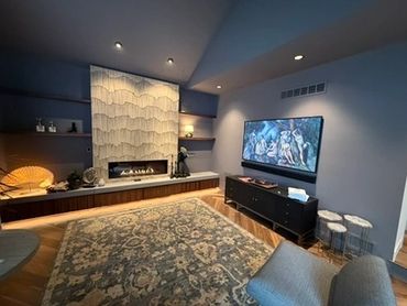 Cozy living room with modern fireplace and wall-mounted TV.