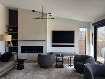Modern living room with neutral tones and sleek furniture.