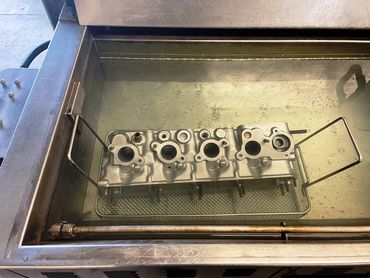 Cylinder head in the ultrasonic rinse tank before assembly