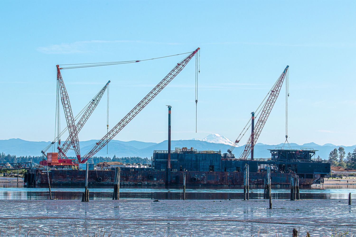 A ship in the Snohomish River with Mt. Baker in the background.