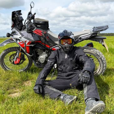 Lorand, your guide, beside his adventure motorcycle during a guided tour.