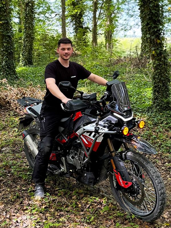 Lorand, founder of LORAAND, on a CFMOTO 450MT during a guided tour in Salisbury Plain.
