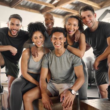 diverse of people in workout clothes smiling and looking friendly