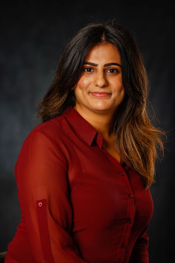 Lady posing for headshots 