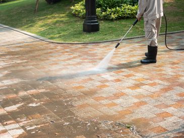 Power washing a driveway