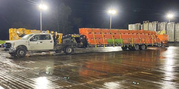 Driver hauling barriers and containment for drilling and production sites 