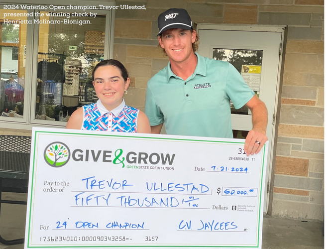 Trevor Ullestad claims the $50,000 prize presented by Henrietta Molinaro-Blonigan.