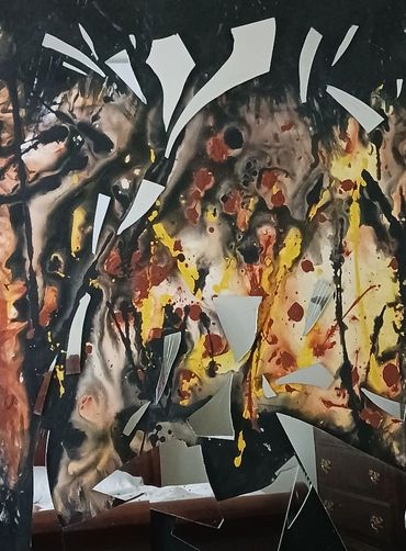 A mirror broken into sharp pieces, mounted in pieces onto a ridged, organic colored background. Look