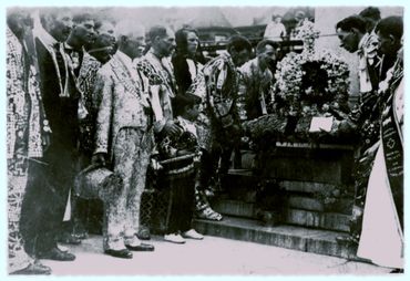 Henry Croft attending a funeral (pearly with the top hat)