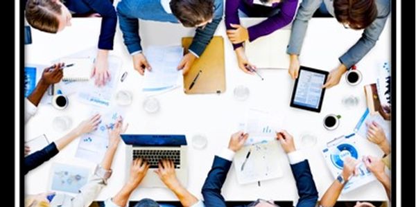 overhead view of office conference room table,  meeting being held