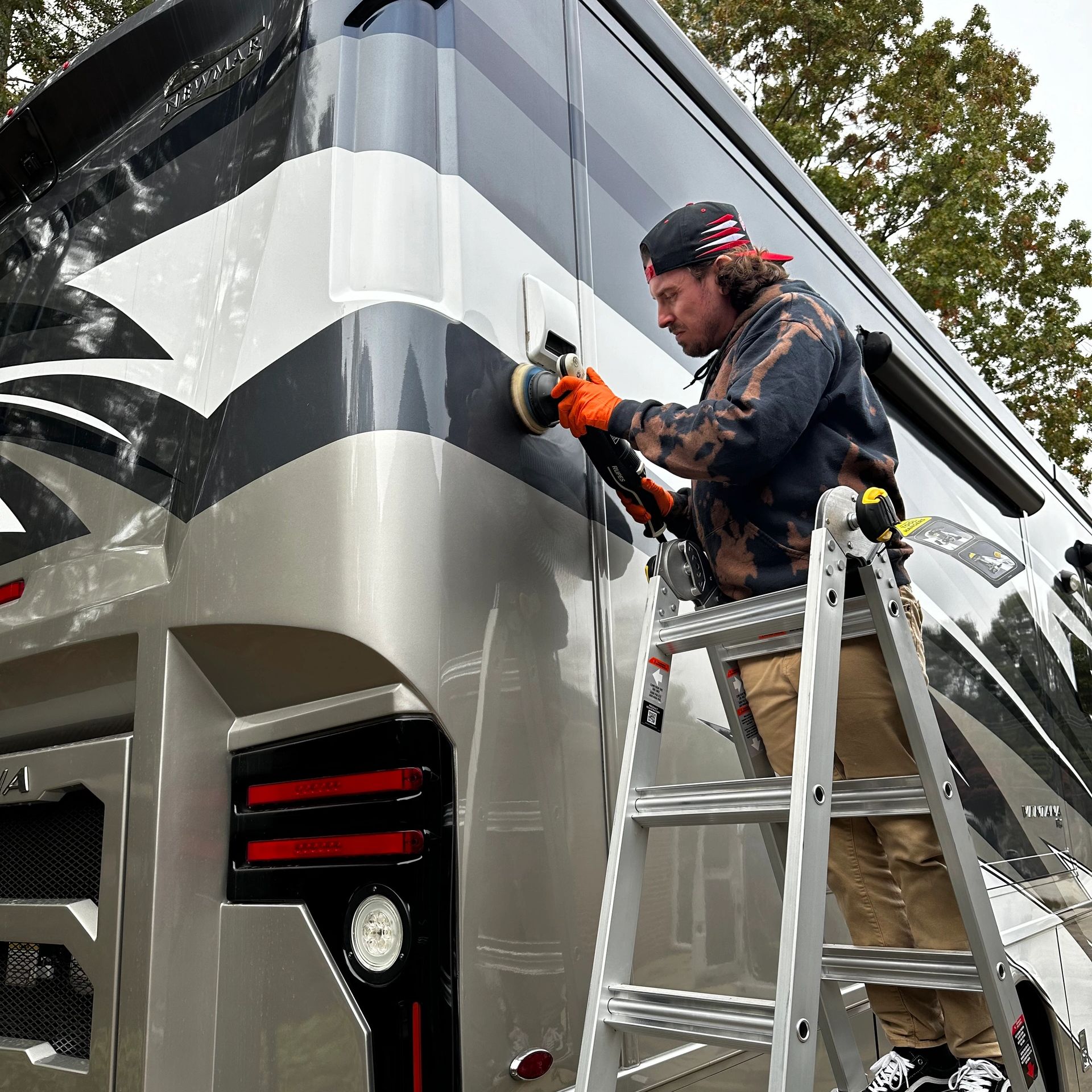 mobile detailing team cleaning RV windshield and front cap in Braselton GA