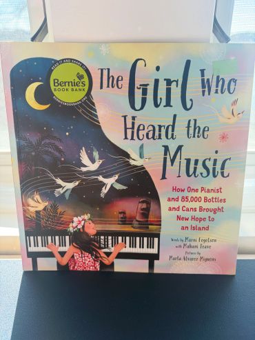Book cover of "The Girl Who Heard the Music."