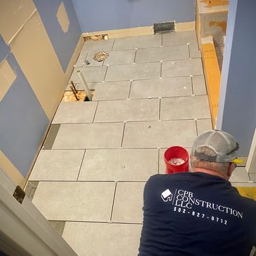 Bathroom renovation, tile floor installation, indoor renovation, bathroom remodeling
