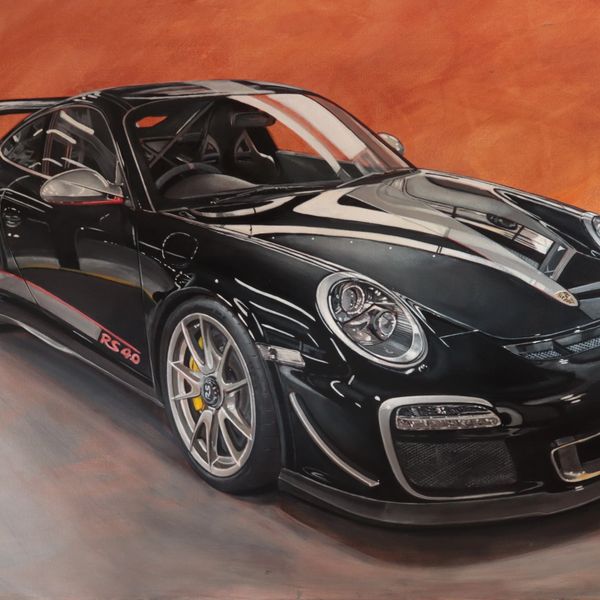 Black Porsche sports car with RS 60 branding on an orange background.