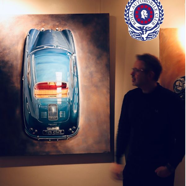Man admiring a detailed painting of a classic blue car in an art gallery.