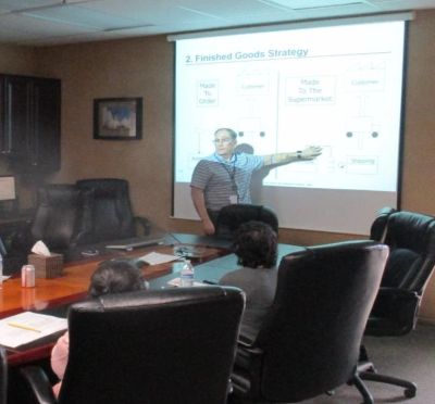 Man presenting a business strategy in a conference room.